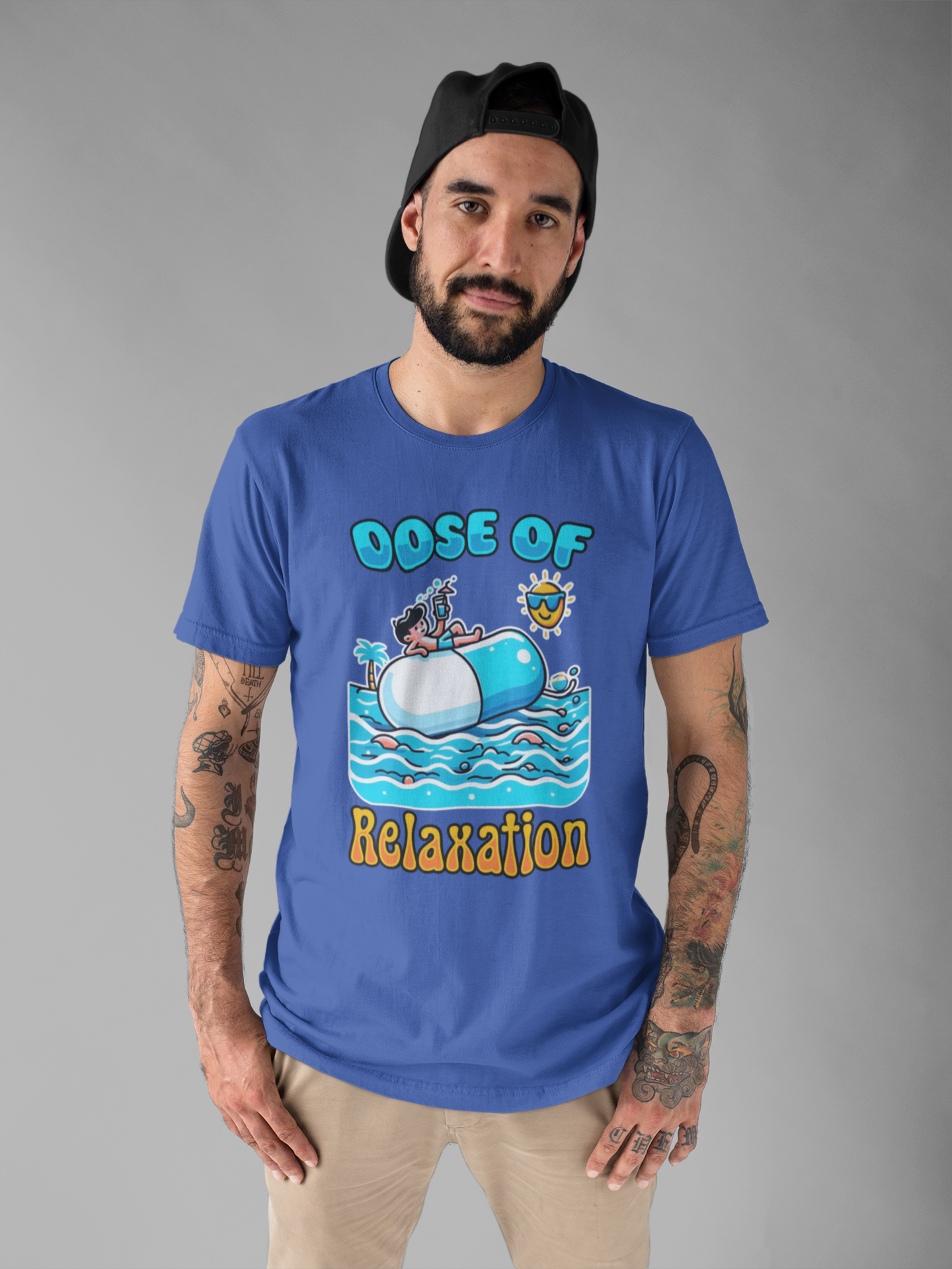 Dose of Relaxation | Boy Sitting on Pill Floating on Water with Drink, Sun & Palm Tree Graphic T-Shirt