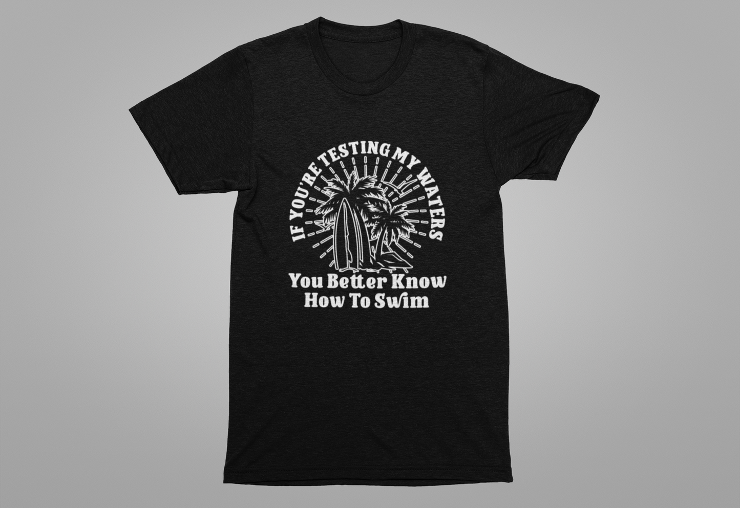 Test My Waters Surf T-Shirt – Beach Palm Trees & Rocks Graphic with Bold Quote