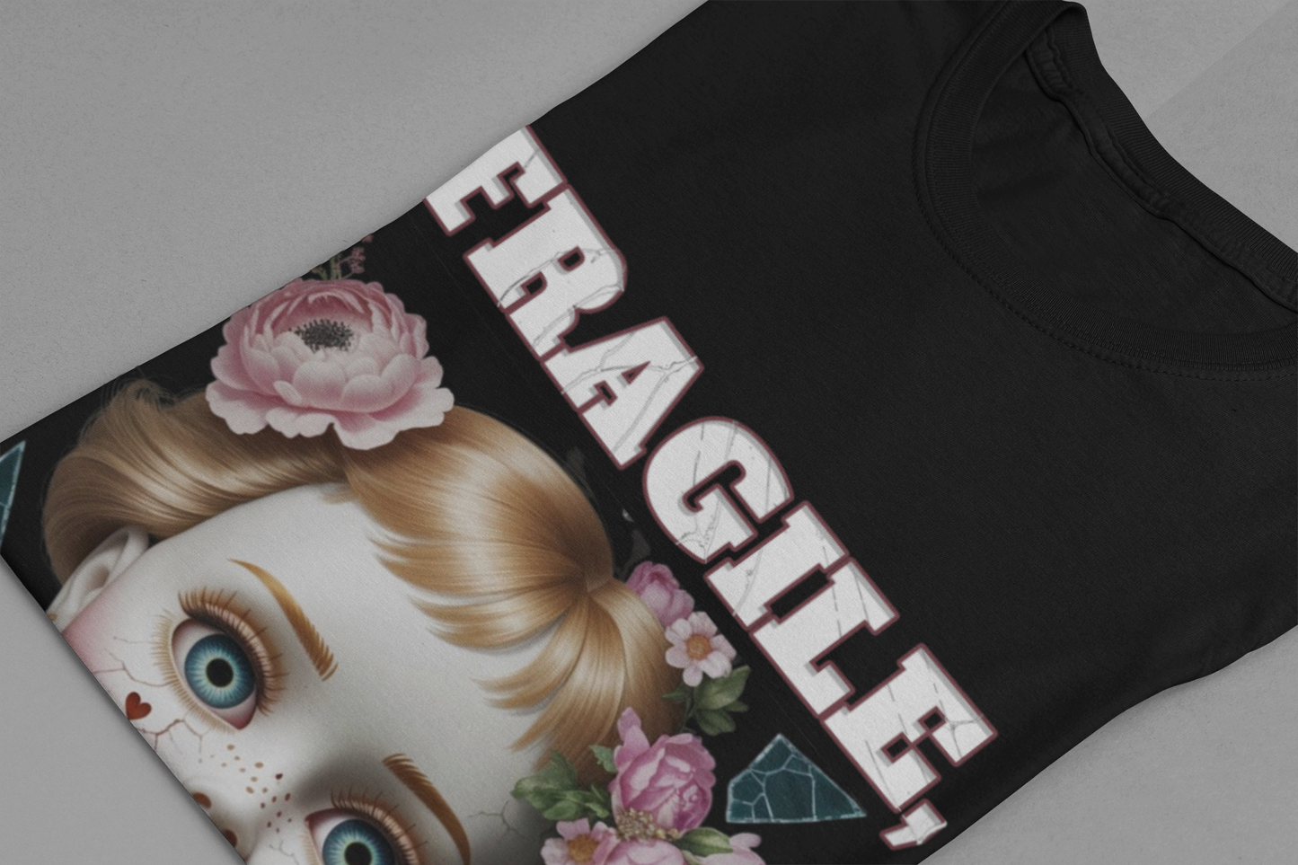 Fragile, But Not Innocent | Doll Face with Flowers & Cracks Graphic T-Shirt