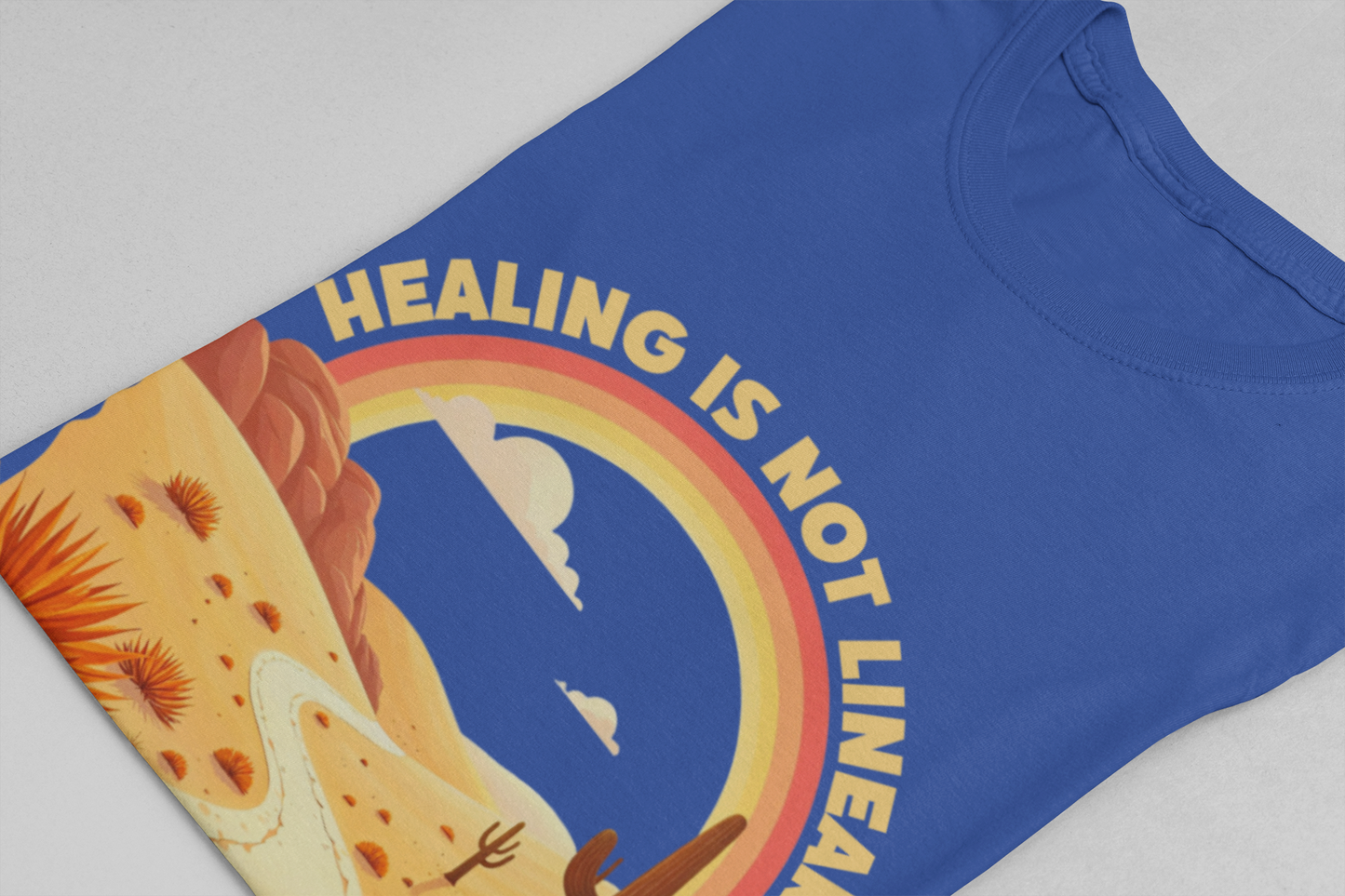 Healing Is Not Linear – Warm Desert Rainbow & Winding Road Graphic T-Shirt