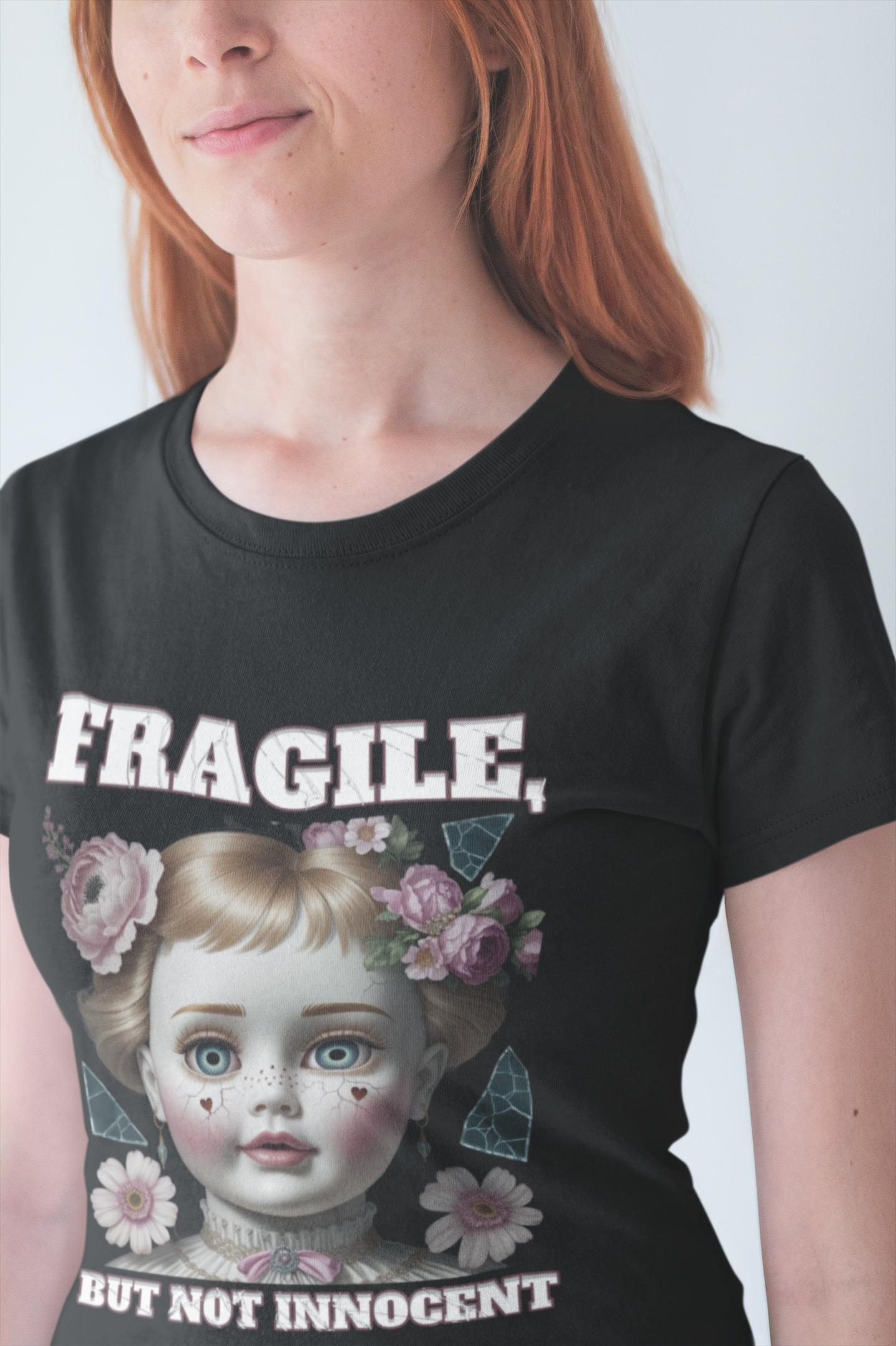 Fragile, But Not Innocent | Doll Face with Flowers & Cracks Graphic T-Shirt