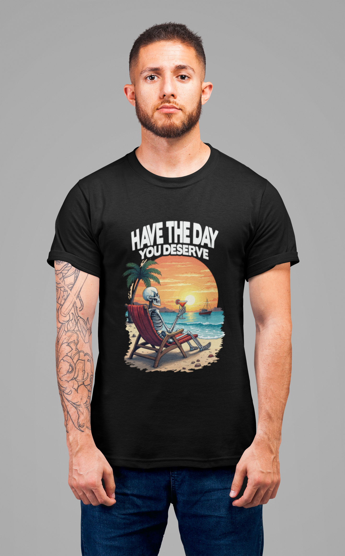 Have the Day You Deserve Tshirt – Relaxing Skeleton with Drink on Beach Sunset